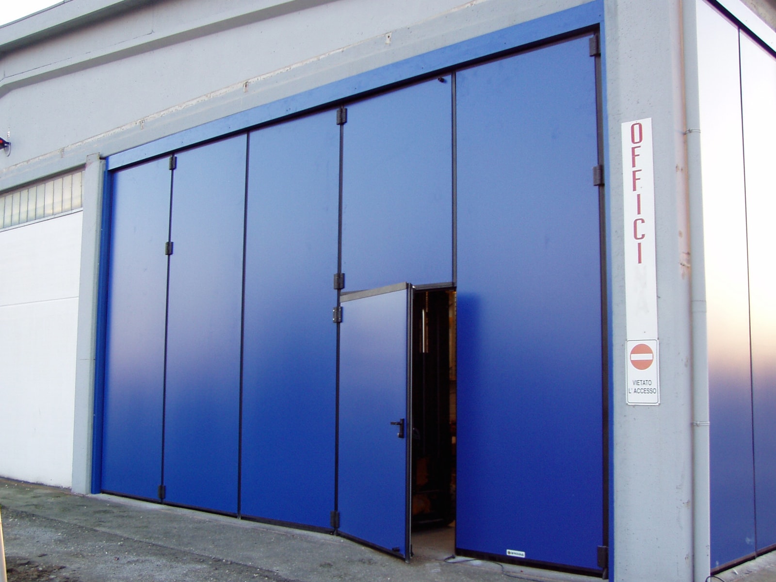 Blue insulated steel folding doors