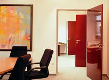 Hormann OIT multipurpose door in red installed in office block room