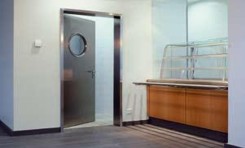 OIT multipurpose door with porthole circular windowed section in aluminium in catering kitchen facility