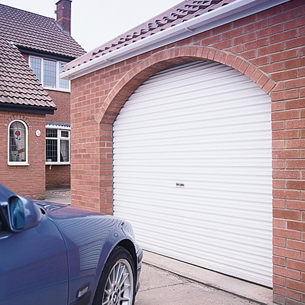white steel roller garage door in arched opening