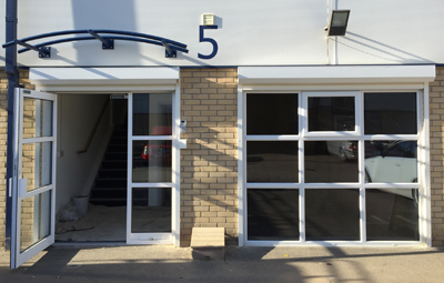 fully opened security shutters on an office entrance