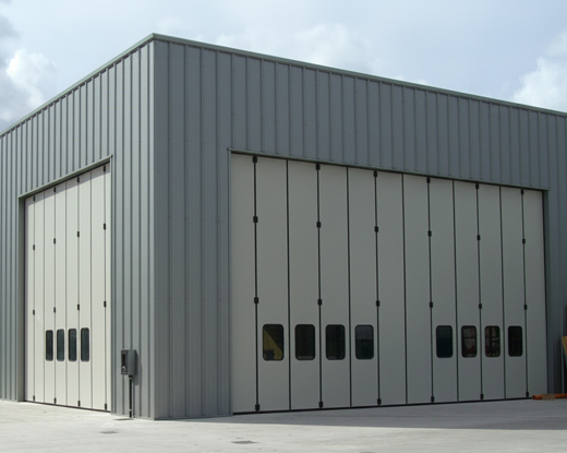 Bi-folding industrial door