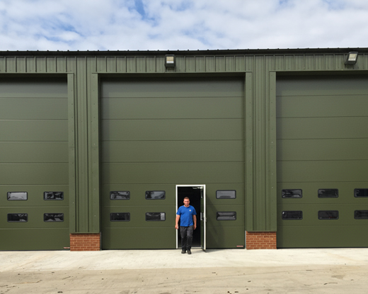 Sectional door with wicket entrance