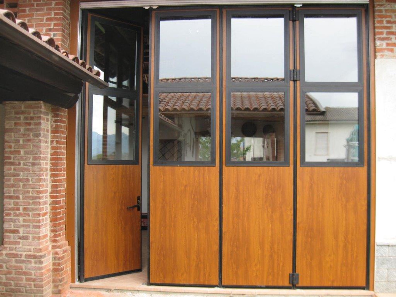 woodgrain finish folding door with windows